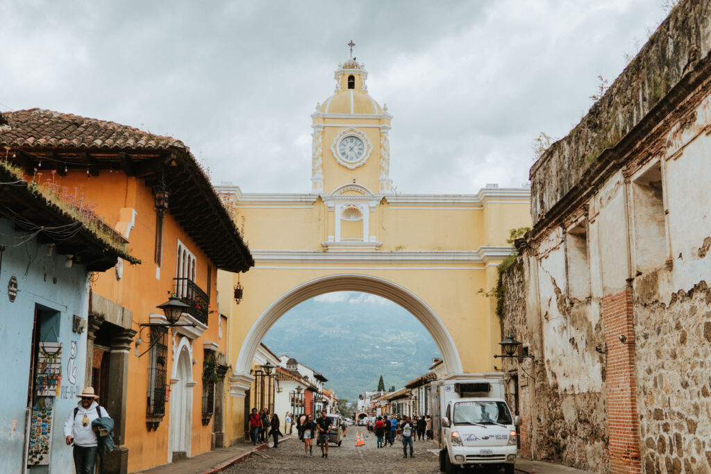 Iconic arch in Antigua, Guatemala, framed by colonial buildings