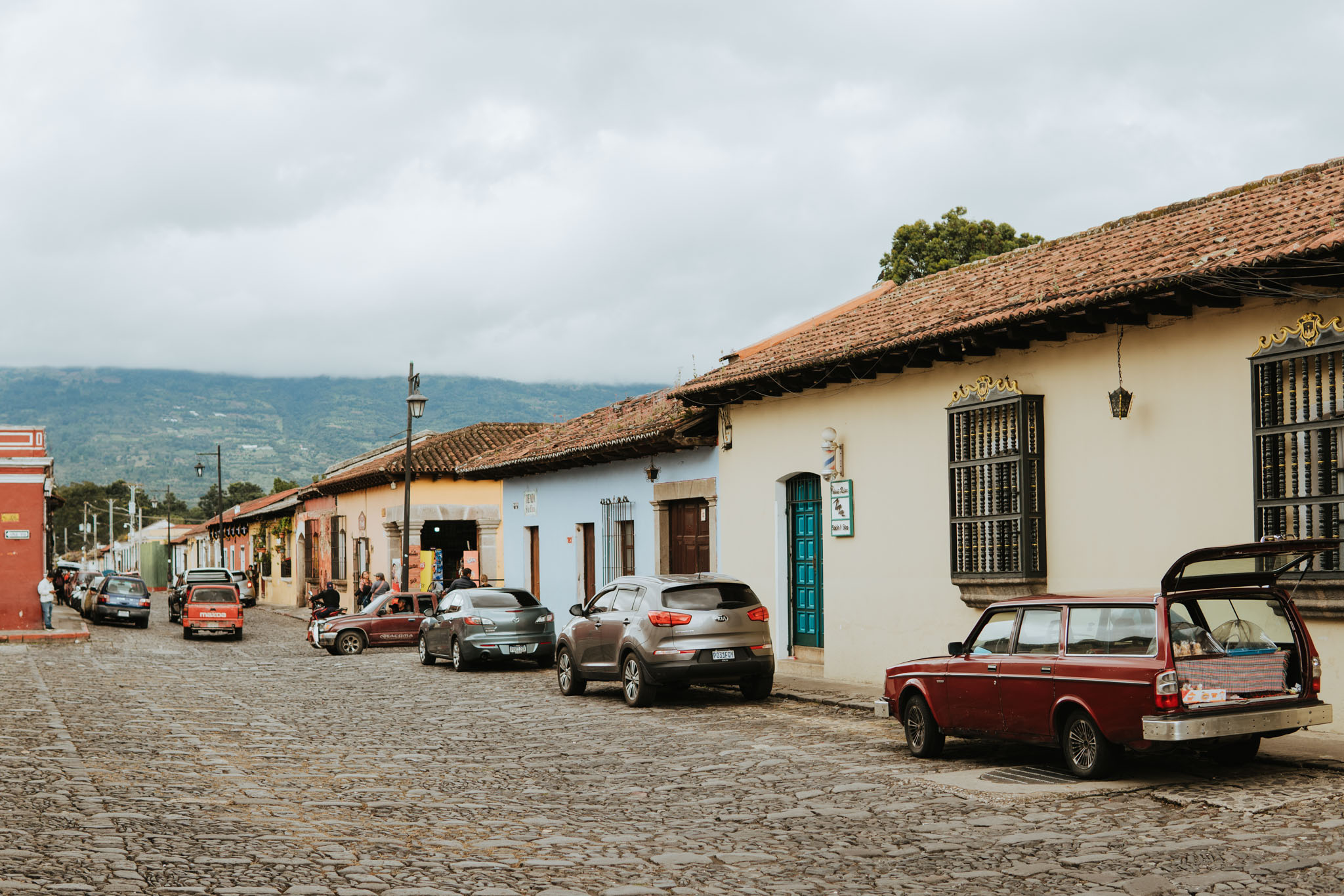 Colorful buildings line a cobblestone street in Antigua Guatemala