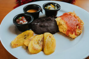 Guatemalan breakfast consisting of beans, eggs and plantains at Cafe Sabor Cruceno