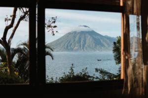 Scenic view of a volcano over Lake Atitlan from a bungalow at Hotel Arca De Noe